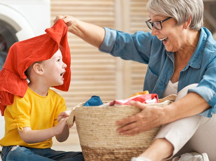 grandma and child doing laundry